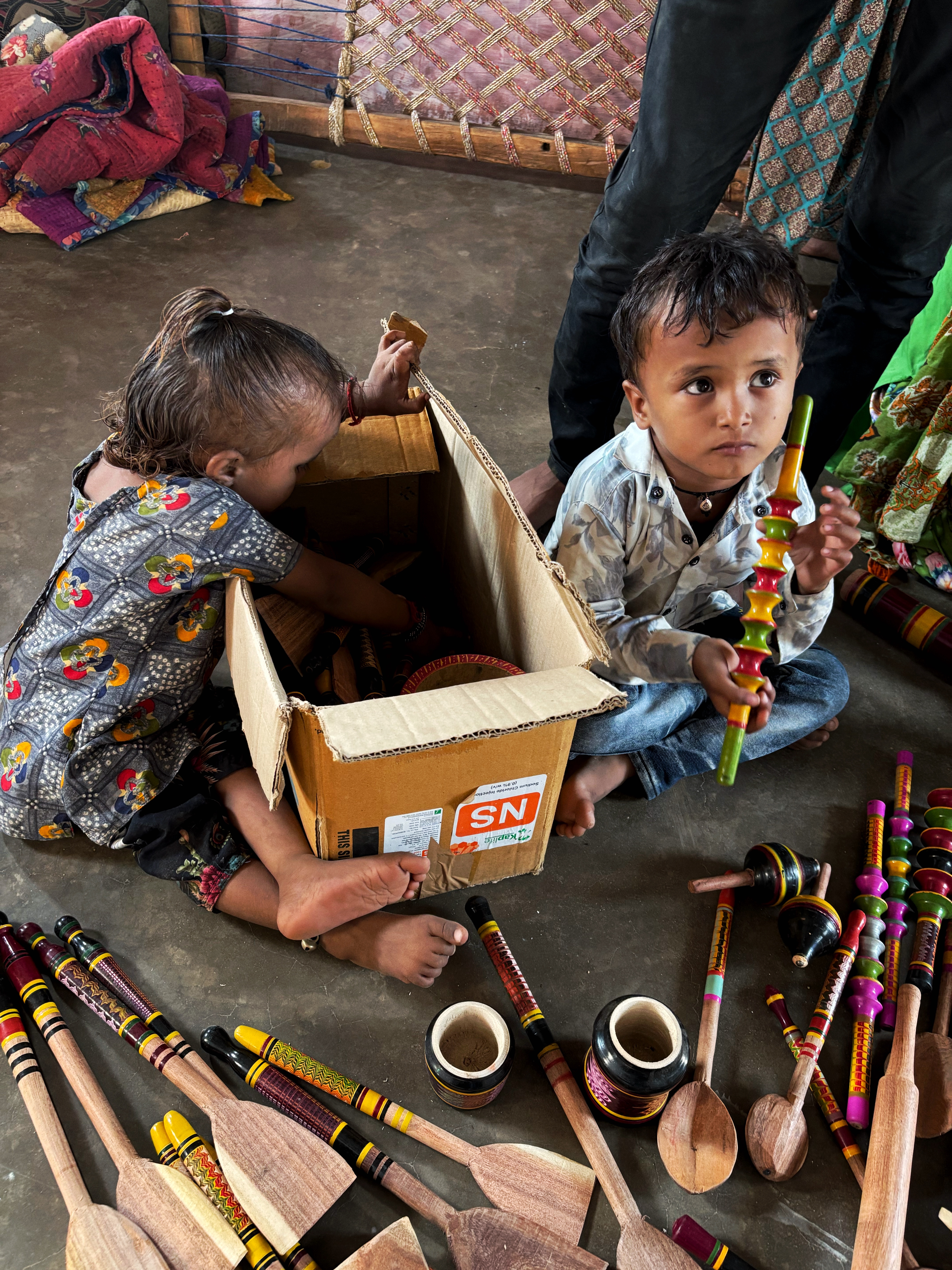 Children playing with colorful handcrafted toys
