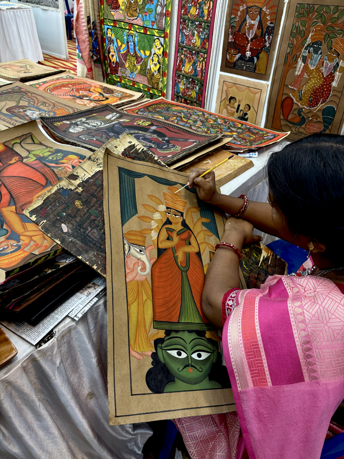 An artisan painting folk art